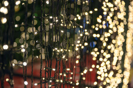 Glittering string lights with bokeh shining decoration on Christmas Eveの写真素材