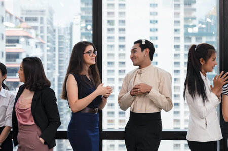 Attractive young caucasian business partner standing with crossed arms with smiling and looking at...
