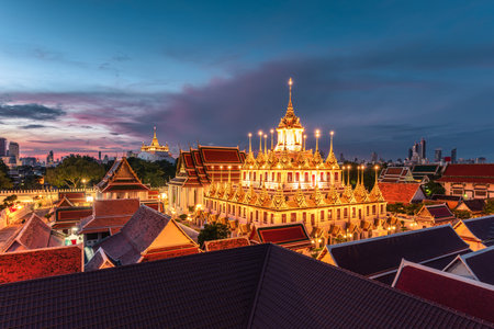 Golden metal castle illuminated, Wat Ratchanatdaram Woravihara, Loha Prasat temple in the morning at Bangkok, Thailandのeditorial素材