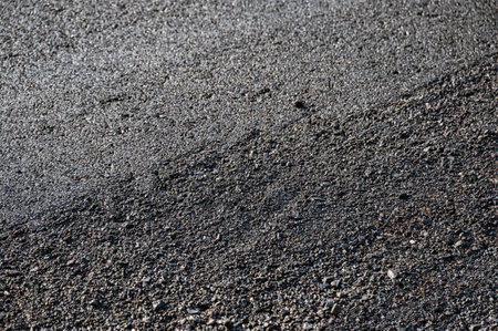 New asphalt tarmac texture road of repairing on the damaged highway in construction siteの写真素材