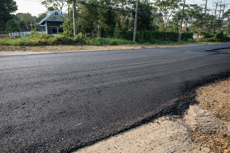 New asphalt tarmac texture road of repairing on the damaged highway in construction siteの写真素材