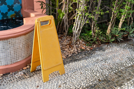 Empty yellow signboard for notification sign standing on the floorの写真素材