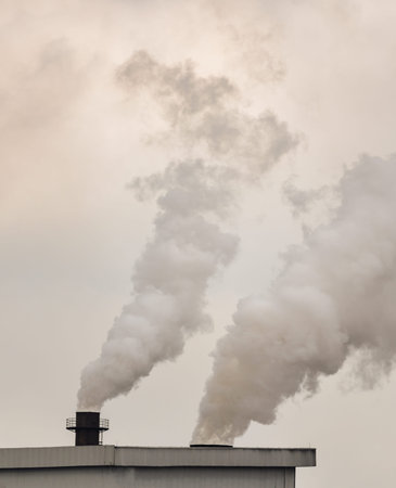 Emission smoke pollution to the air from industrial plant chimney. Environmental issues, global...