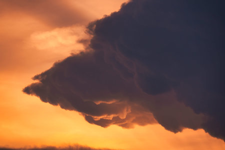 Beautiful dramatic sky and cumulus clouds in the sunset. Natural background