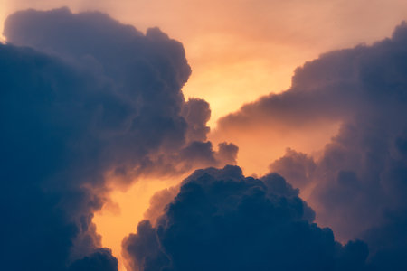 Beautiful dramatic sky and cumulus clouds in the sunset. Natural backgroundの写真素材