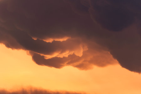 Beautiful dramatic sky and cumulus clouds in the sunset. Natural background
