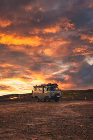The van parked with beautiful sunset sky on top of mountain in Icelandic Highlands on summer at Icelandの写真素材