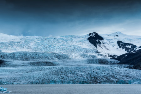 Large natural glacier and moody weather on summer in Iceland. Climate change, Global warming conceptの写真素材