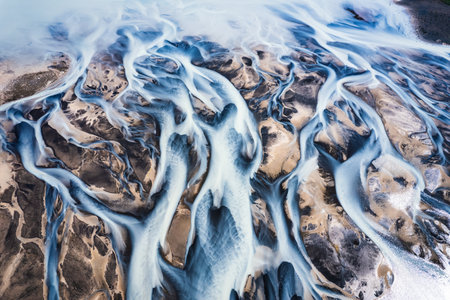 Aerial drone view of fantastic abstract Icelandic glacier rivers melting pattern in summer at highlands of Icelandの写真素材