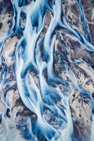 Aerial drone view of abstract beautiful glacier rivers pattern on earth in highlands of Icelandの写真素材