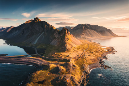 Aerial view of spectacular Mount Eystrahorn in the Krossasnesfjall mountain range with sunlight shine in the morning on coastline in summer at East of Icelandの写真素材