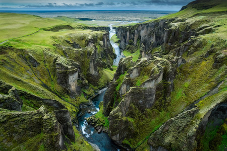 Stunning aerial view of Fjadrargljufur canyon naturally eroded with Fjadra flowing through ravine in summer at Icelandの写真素材