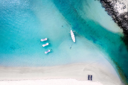 Top view of sailboat in tropical sea beach on summer vacation