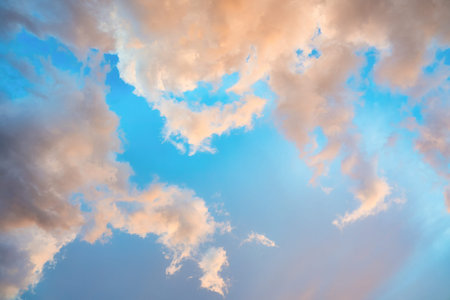 Beautiful dramatic orange clouds on blue sky in the evening