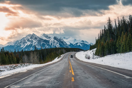 Road trip with rocky mountains on highway road in national park at Kootenay plains area, Alberta, Canadaの写真素材