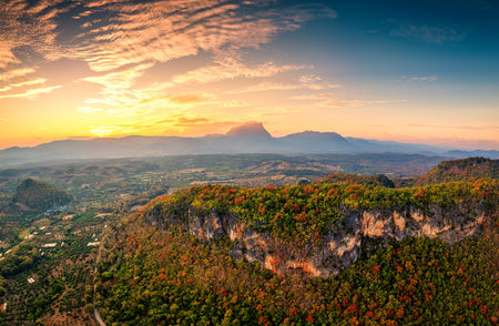 Aerial view of beautiful sunset over Doi Luang Chiang Dao mountain with tropical rainforest during...
