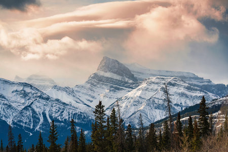 Majestic Rocky mountains with snow covered and cloud in the sky at national park. Located in...