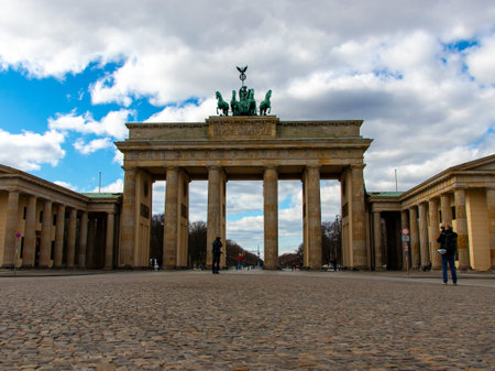 Berlin, Germany - March 21, 2020 - Pariser Platz with the Brandenburg Gate at lunchtime, hardly any...