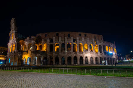 The historic landmark of Rome at night, the Colosseumの写真素材