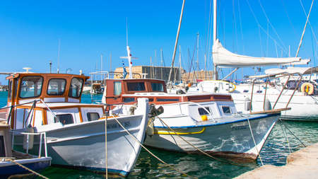 Heraklion, Greece - August 16, 2020 - Boats in the historic port of the city of Heraklion on the island of Crete (Greece)のeditorial素材