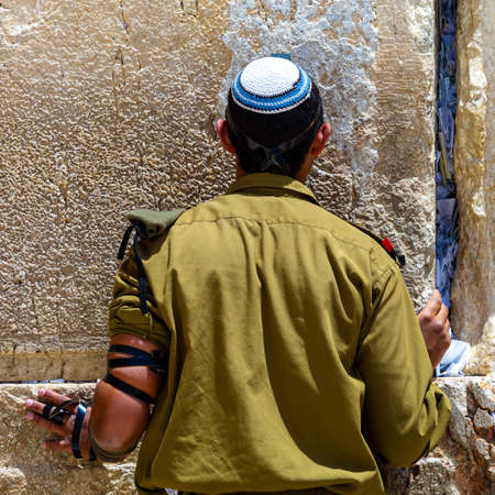 Jerusalem, Israel - May 09, 2022 - An Israeli soldier prays at the Western Wallのeditorial素材