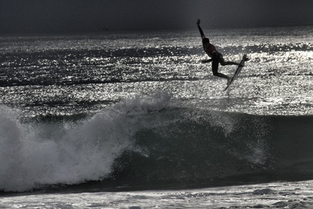 Surfer's silhouette at Supertubos Beach, Peniche, Portugalの写真素材