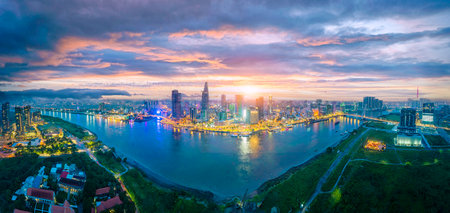 Aerial cityscape view of HoChiMinh city and the River Saigon, Vietnam with blue sky. Financial and business centers in developed Vietnam.の写真素材