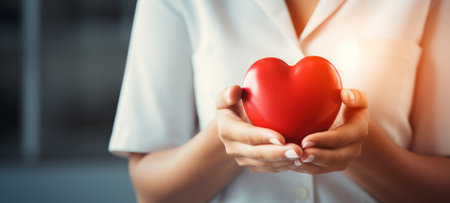 Health care background Close up of female doctor holding red heart. Healthcare and medical concept. created using generative AI toolsの素材