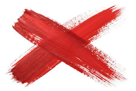 Red cross mark painted with paint brush isolated over the white background, top viewの素材