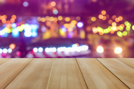 Wooden table montage on ultra violet blurry background for your product and texture conceptの写真素材