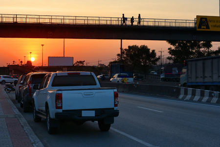 Car parked on road,Car parked on street and sunset in eveningの写真素材