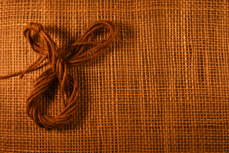 Ribbon made of jute On bamboo floor weave the background.wood background for love coffee and other your designの写真素材