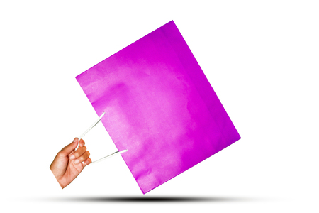 Hand holding bag on white background for shopping concept 2018,Violet bag on handの写真素材