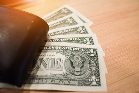dollar for pay or buy product put on wooden table,Money for everyday shopping and Investment for...