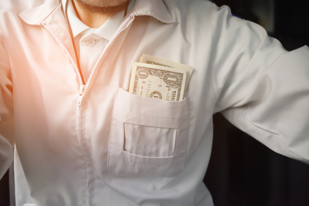 Man with us dollar for use in car,Money for everyday lifeの写真素材