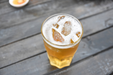 Beer in glass,Beer is a form of alcohol that is fermented.の写真素材