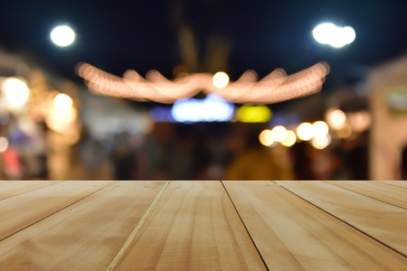 Wooden table background montage ,Wooden table background bokhe light in beautiful night montageの写真素材
