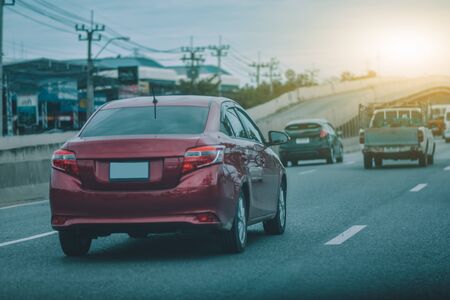 Car parked on road and Small passenger car seat on the road used for daily tripsの写真素材