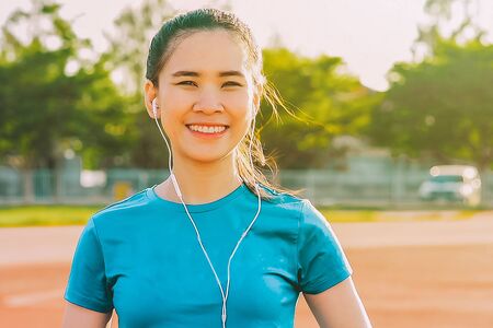 Runner Women jogging or running in evening at sunlightの写真素材