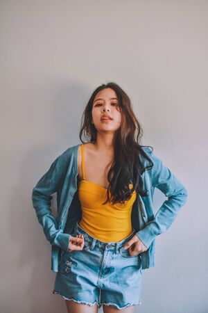 Beauty Asian Women Fashion photo in dark tone vintage,Beauty Asian Women Blue jeans vintage at roomの写真素材
