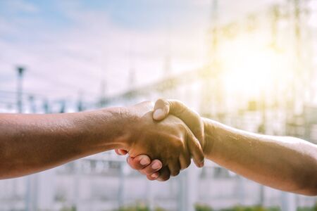 People shaking hands communicate the meaning of unity Business cooperation success teamworkの写真素材