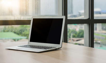 Computer notebook or laptop blank on screen in officeの写真素材