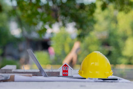 Yellow helmet hard hat safety in site construction for real estateの写真素材