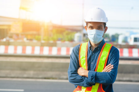 Worker Engineer wear mask protect coronavirus covid19 working outdoor on site road background