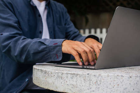 Man using computer online working at homeの写真素材