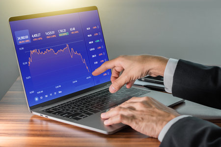 Man using computer trading online, Man investment in stock exchange tradeの写真素材