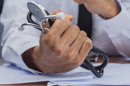 Doctor holding stethoscope  guarantees treatment of disease absolutely safe