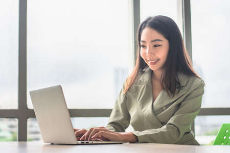 Businesswoman working computer notebook technology sitting officeの写真素材