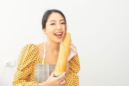 Woman holding bread happy in shop small business