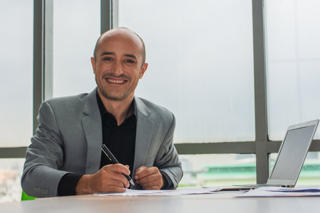 Businessman hold pen smile in office, Businessman smile  happy , Trader online cryptocurrency successの写真素材